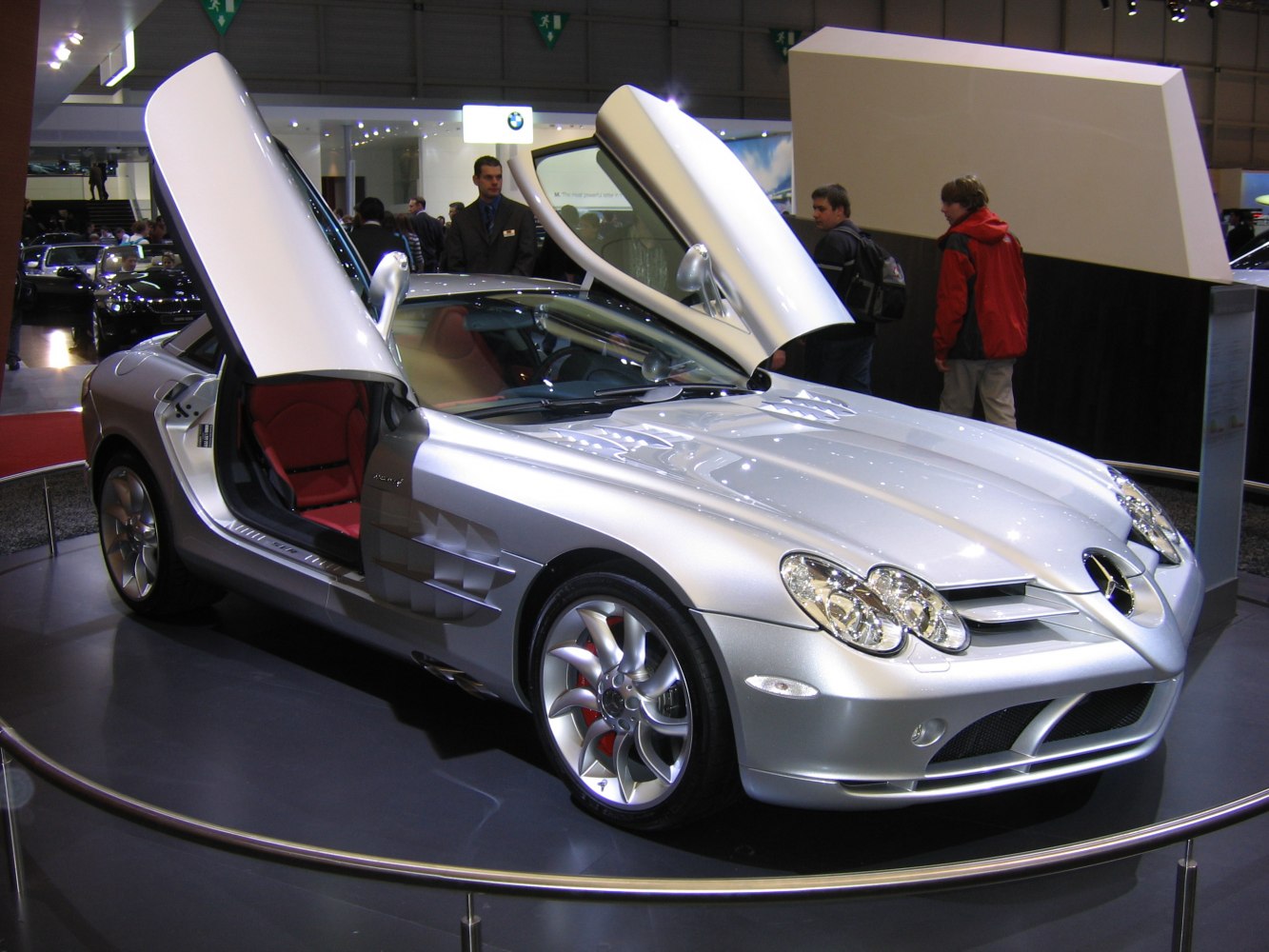 Silver sports coupe with butterfly doors and distinctive multi-spoke wheels