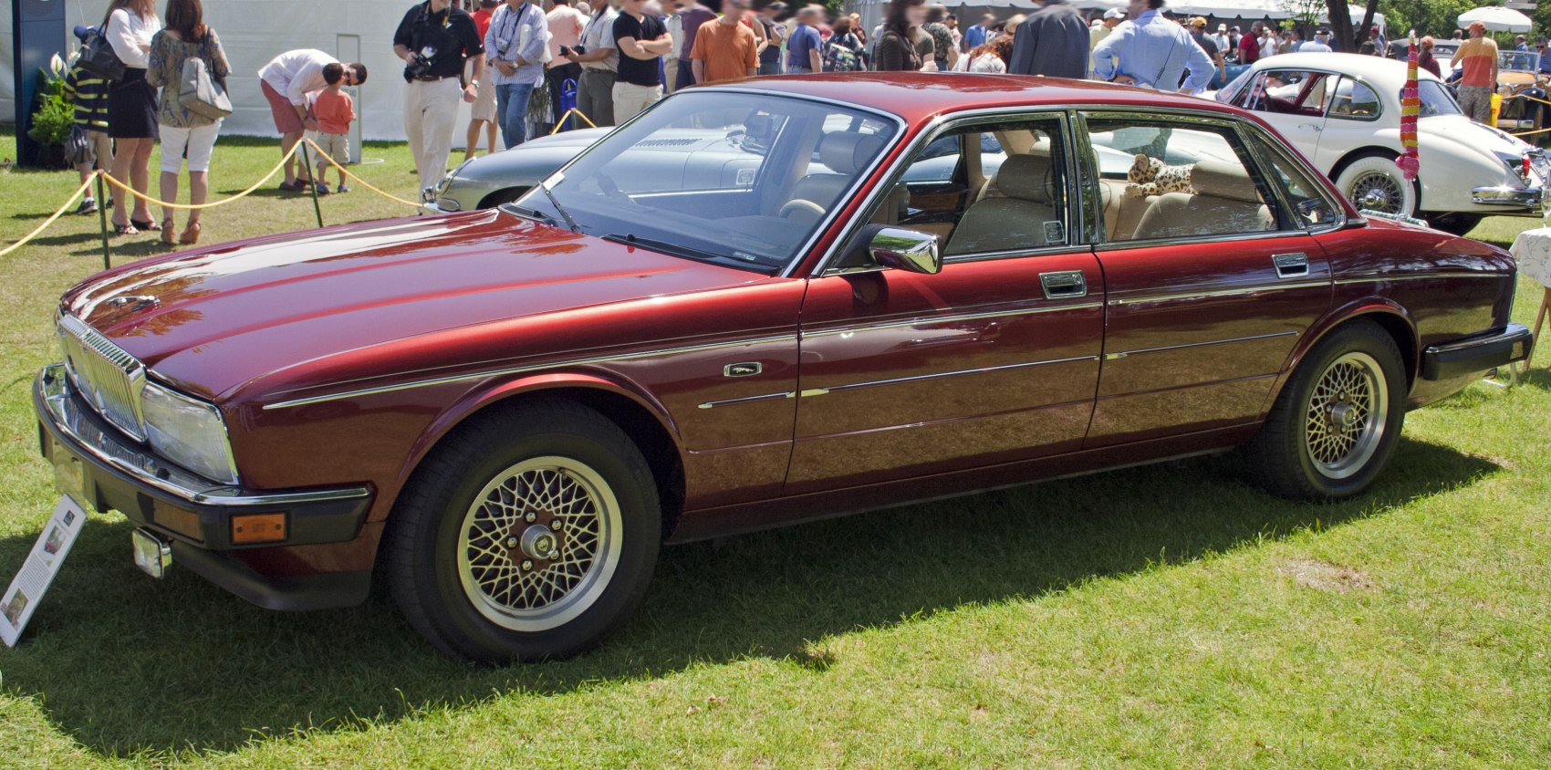 Classic vintage sedan with wire mesh wheels and chrome details