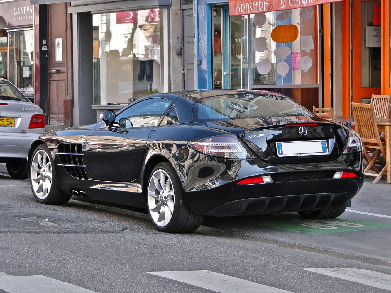 Sleek rear and side profile with signature side vents and dual exhaust pipes