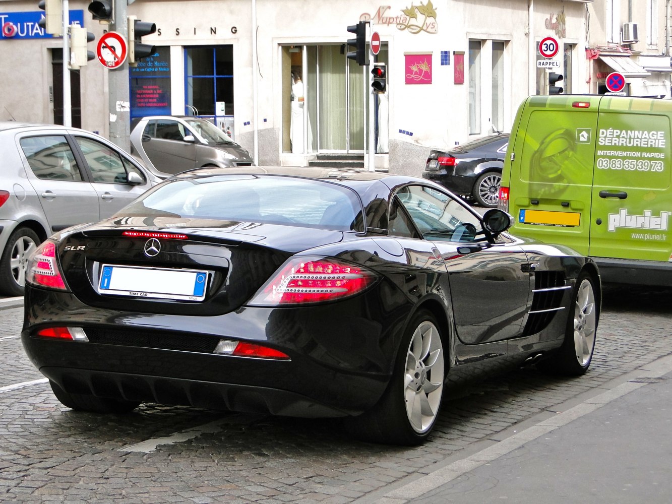 Rear perspective with distinctive tail lights and aerodynamic shape