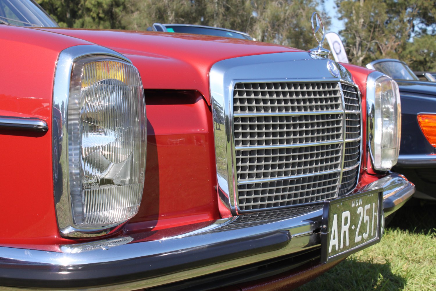 Close-up of vintage car front grille and headlights