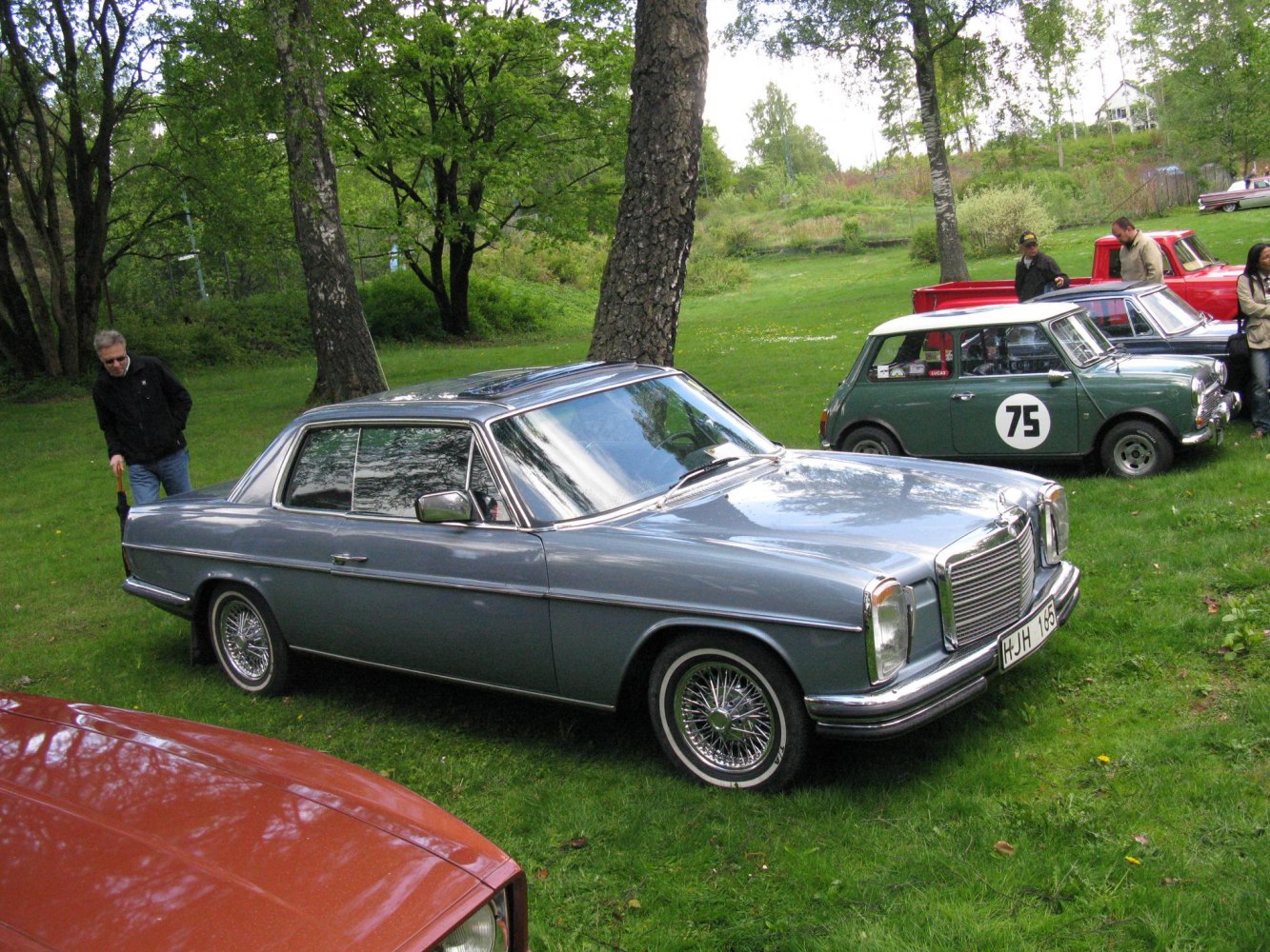 1970s coupe with wire-spoke wheels and chrome rectangular grille