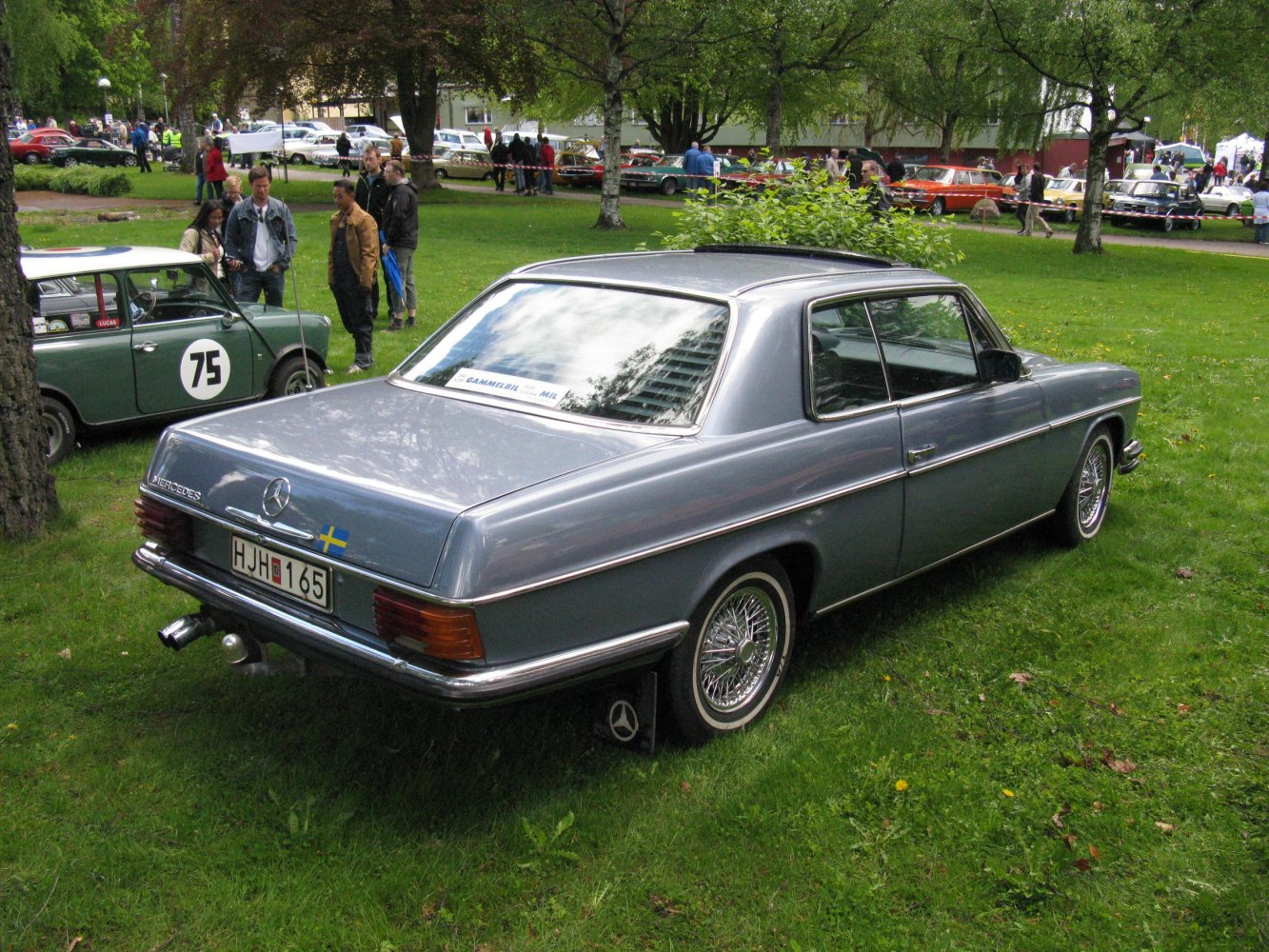 Rear and side view of vintage coupe with wire-spoke wheels