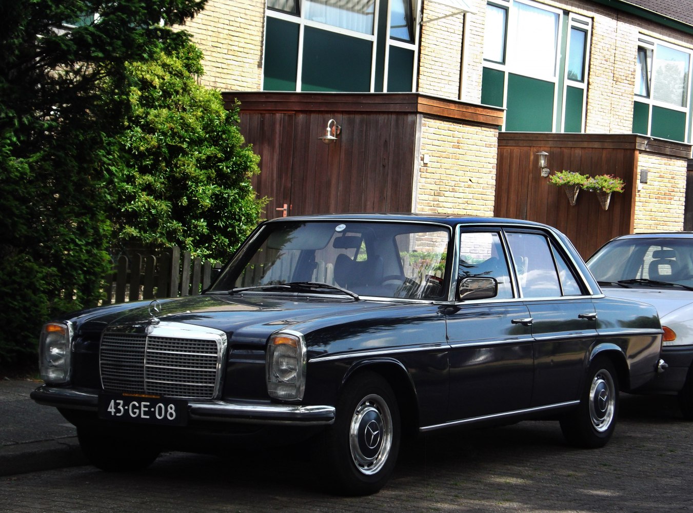 Classic four-door sedan with chrome grille and rectangular headlights