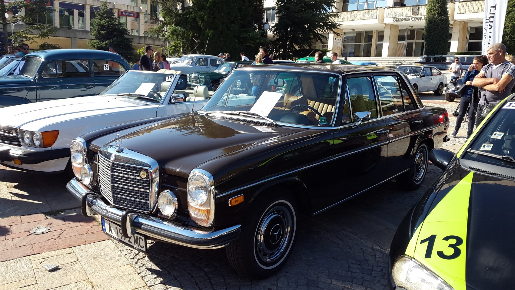 Classic vintage sedan with large chrome grille and round headlights