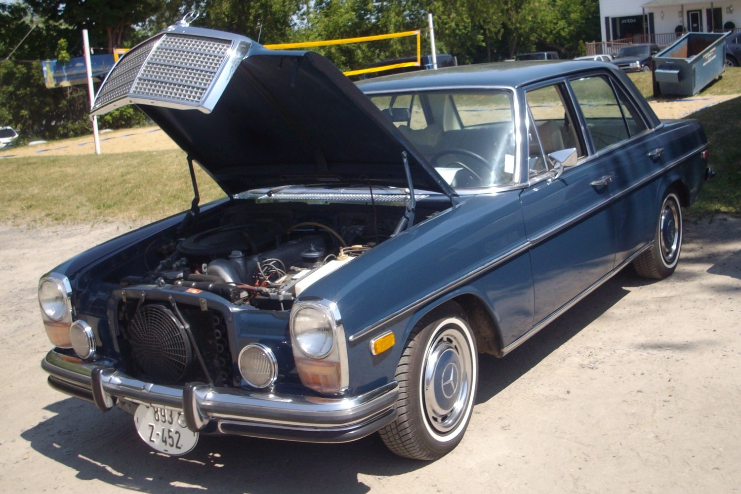 Vintage sedan with open hood and detailed engine compartment