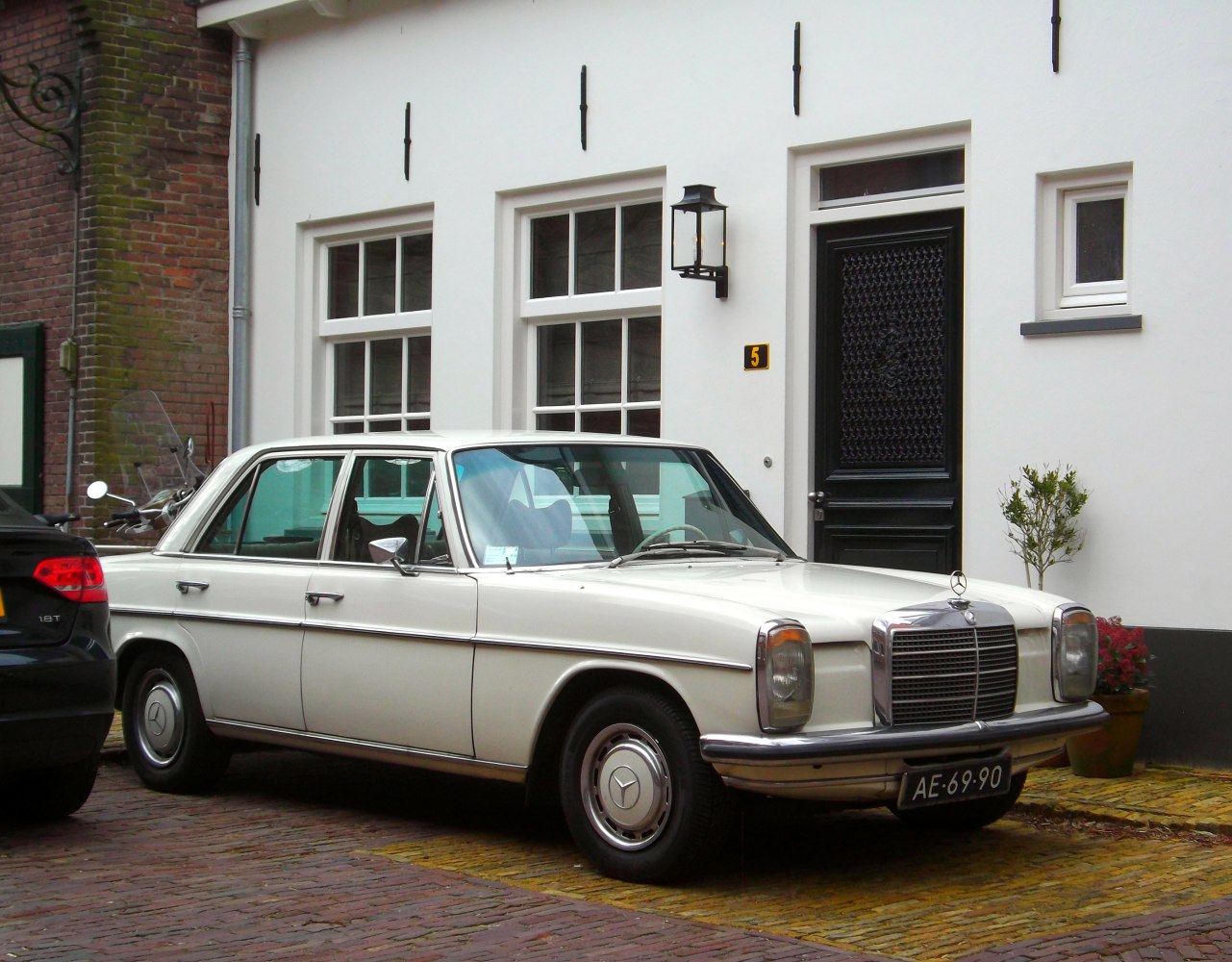 Vintage sedan with chrome grille and round headlights