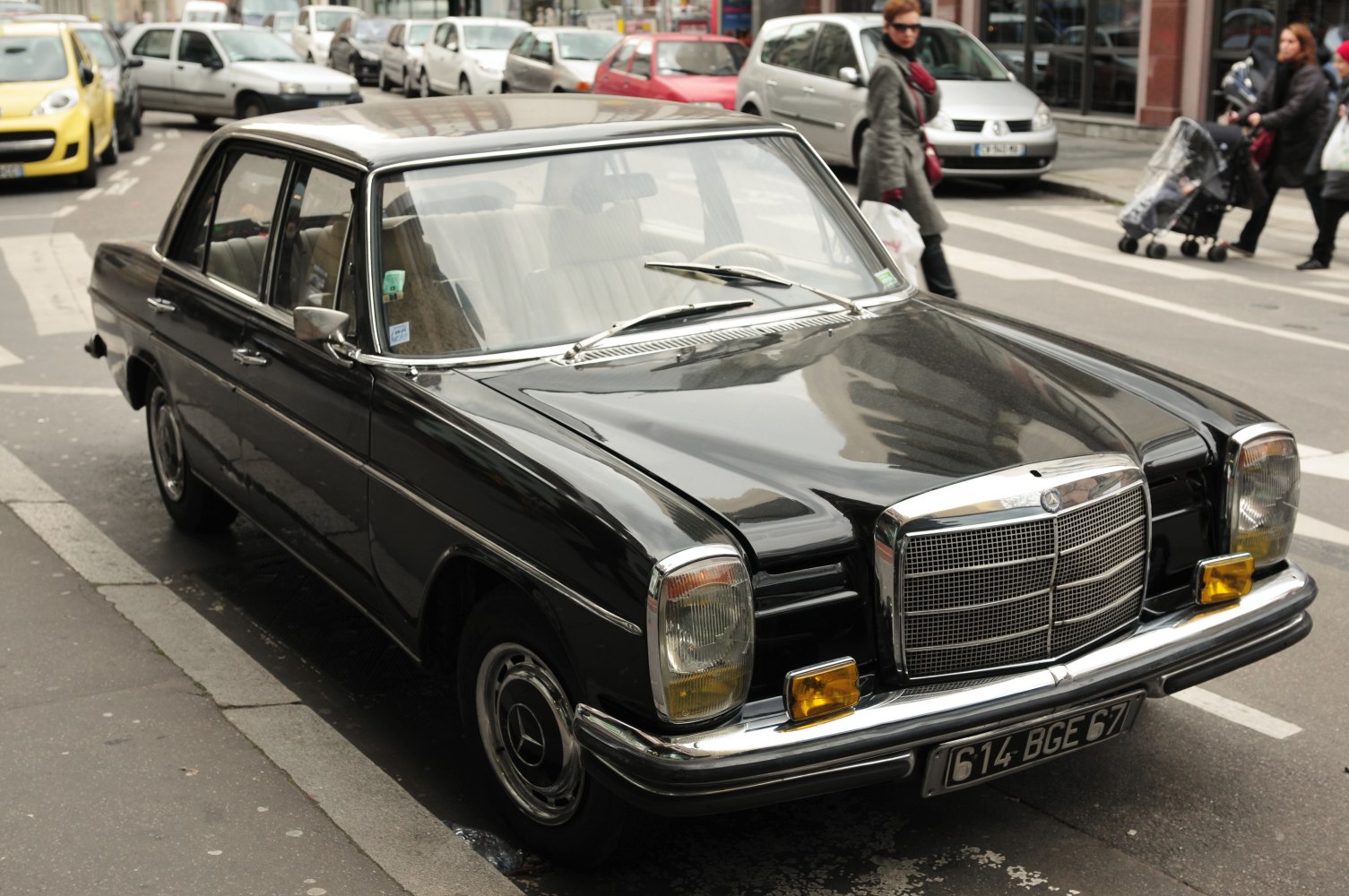 Classic black vintage luxury sedan with chrome grille and square headlights