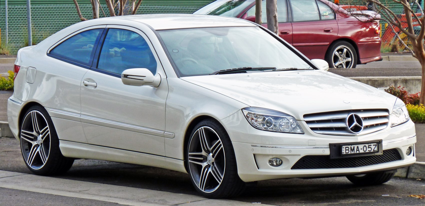 Sleek coupe with front grille and sporty alloy wheels