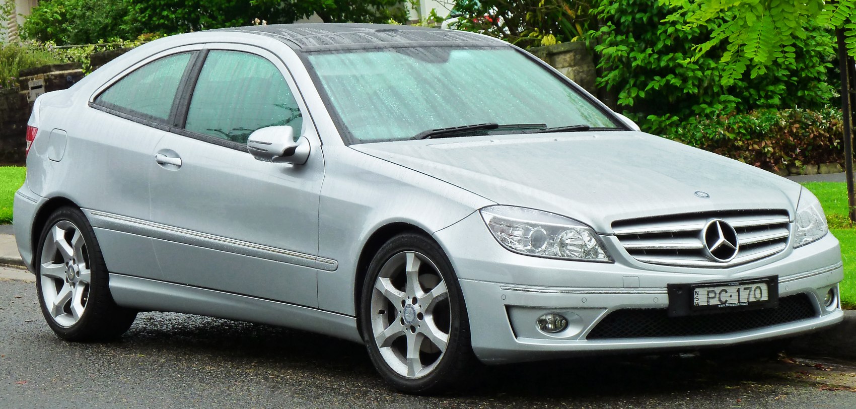 Silver two-door coupe with alloy wheels and sunroof