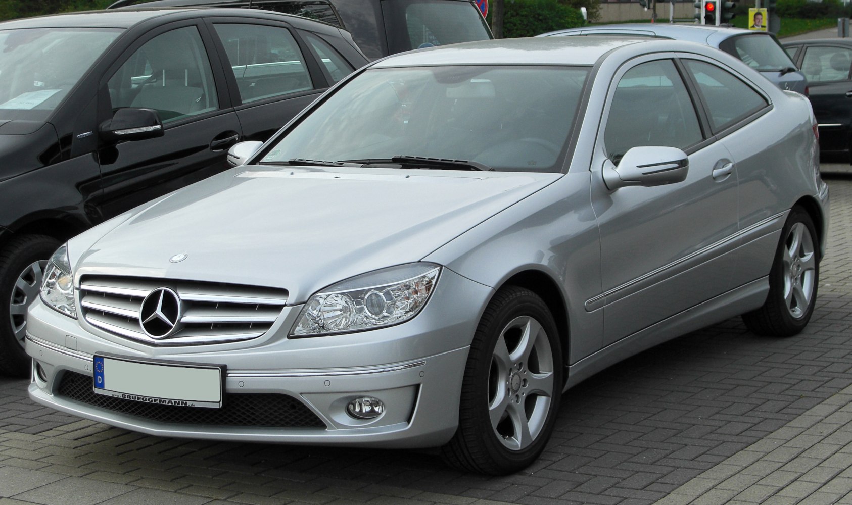 Silver coupe with distinctive front grille and headlights