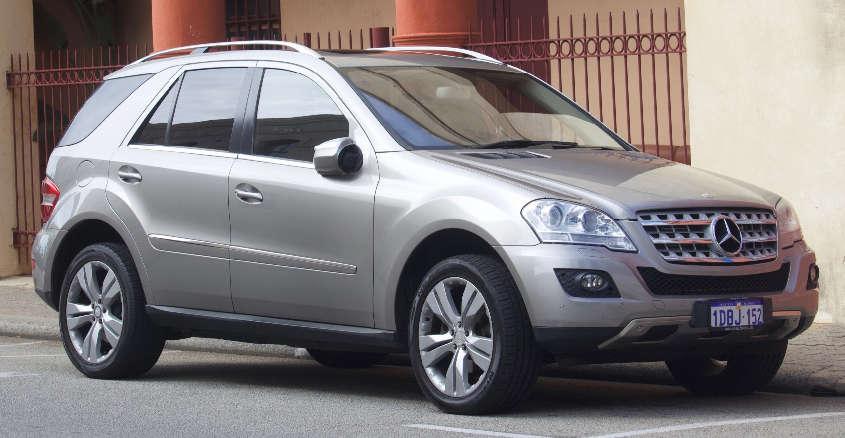 Silver SUV with distinctive grille and roof rails