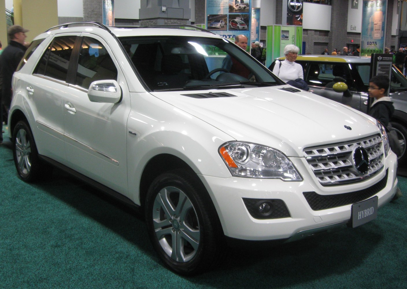 Front view of hybrid luxury SUV with distinctive headlights and grille