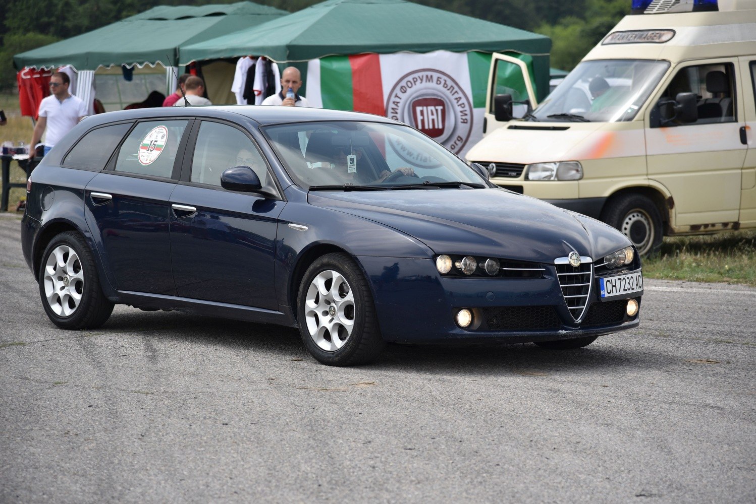 Front three-quarter view of sporty wagon with distinctive headlights and alloy wheels