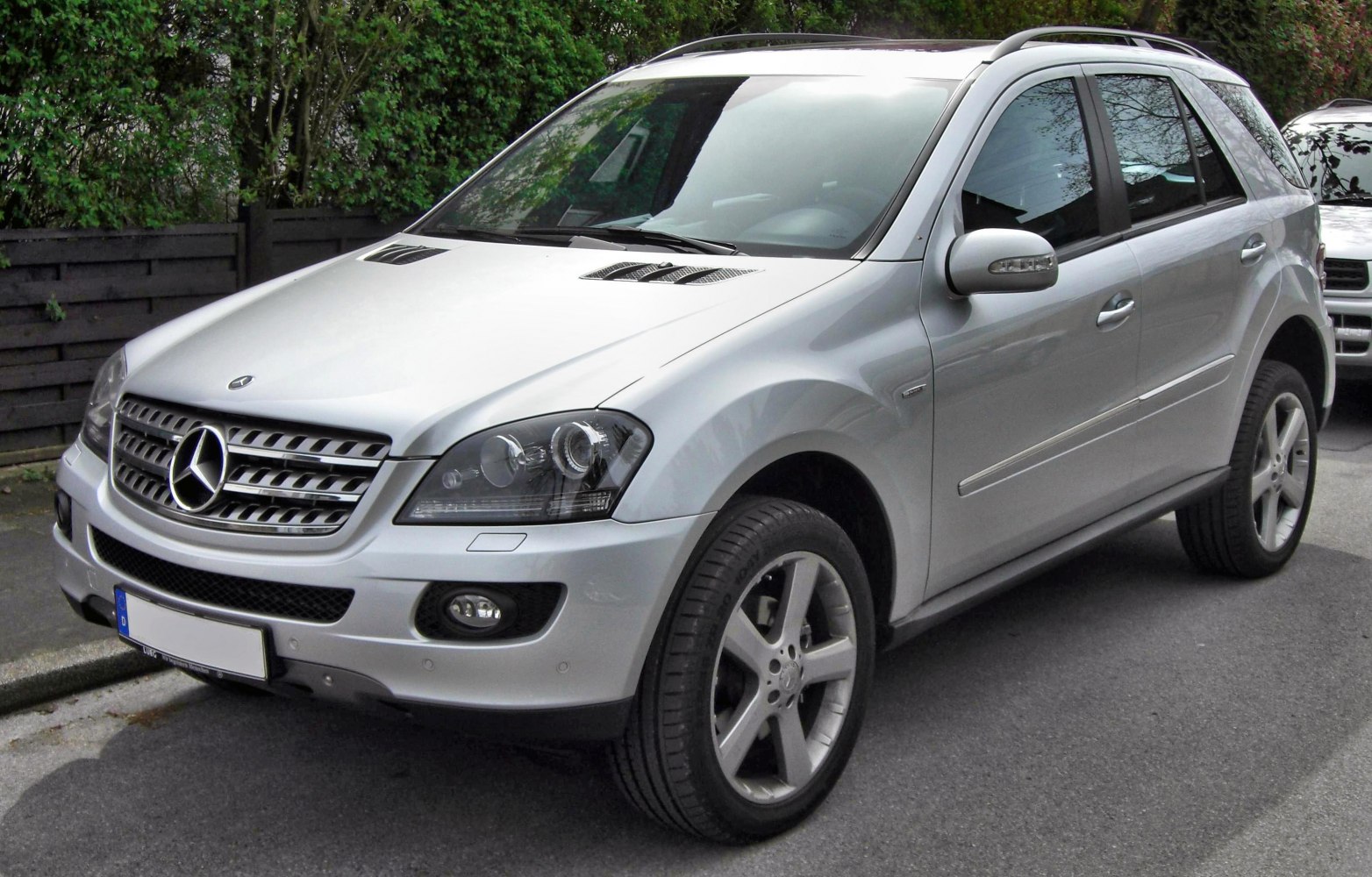 Silver SUV showing front grille, alloy wheels, and bonnet vents