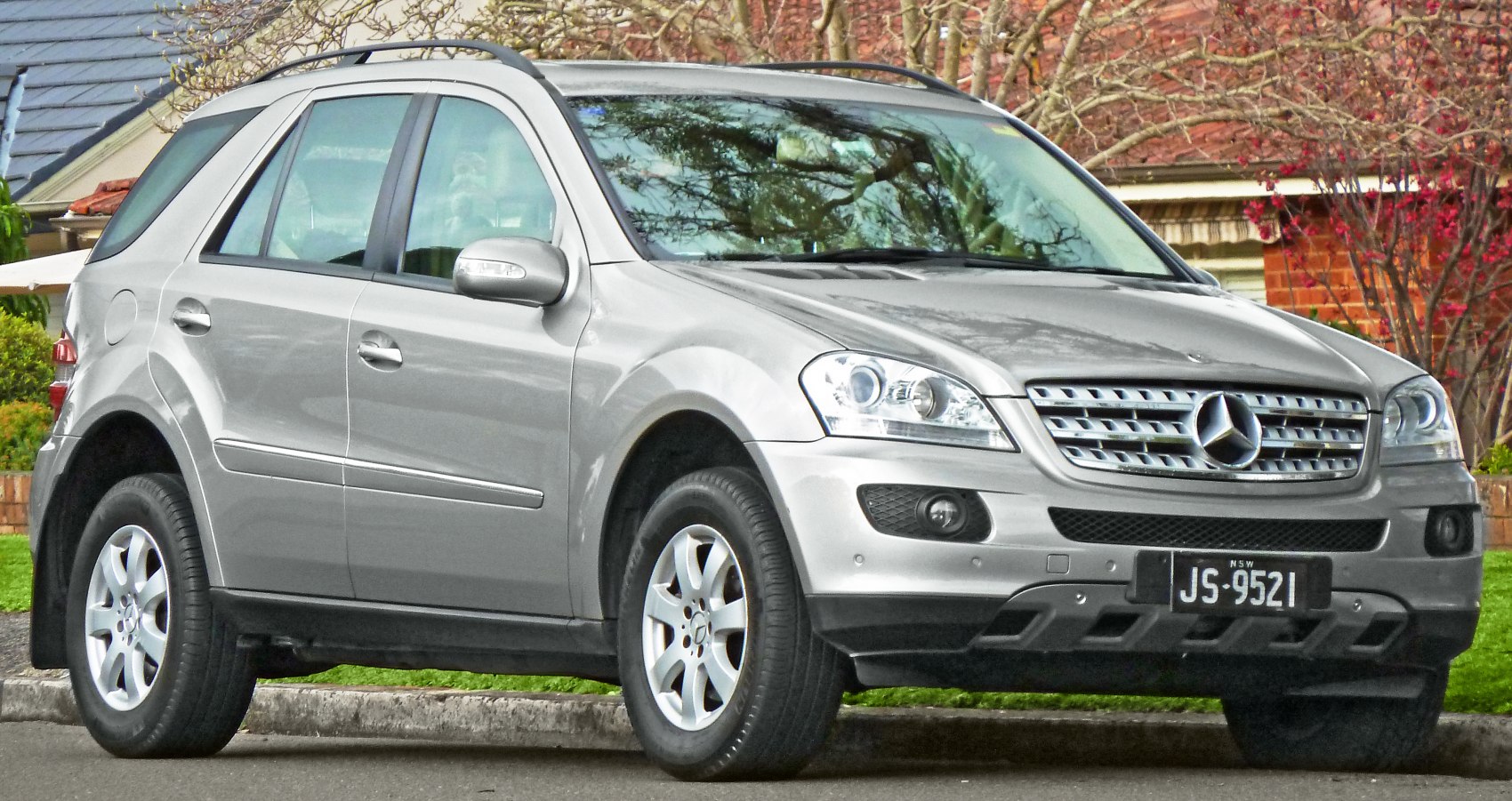 SUV with LED headlights, roof rails, silver paint, fog lights, alloy wheels