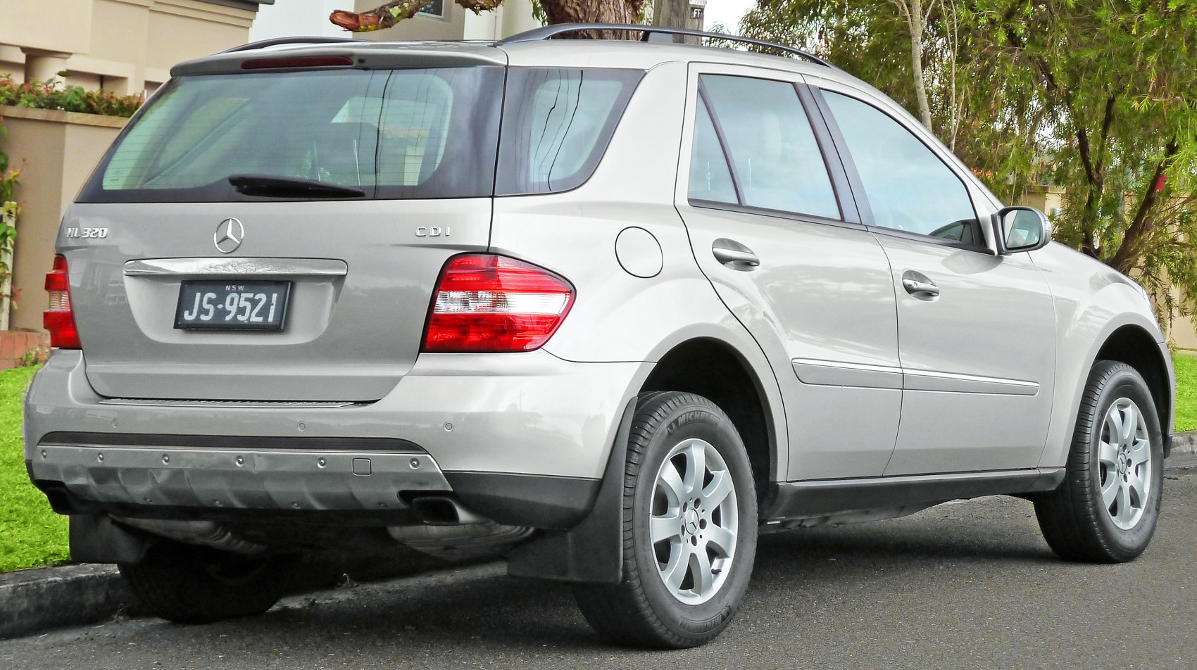 Rear and side view of mid-size SUV with alloy wheels and rear lights