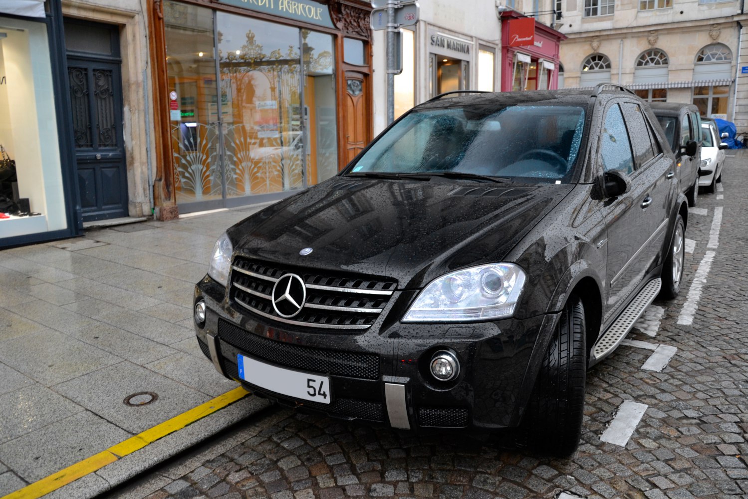 SUV front view with prominent grille and headlights