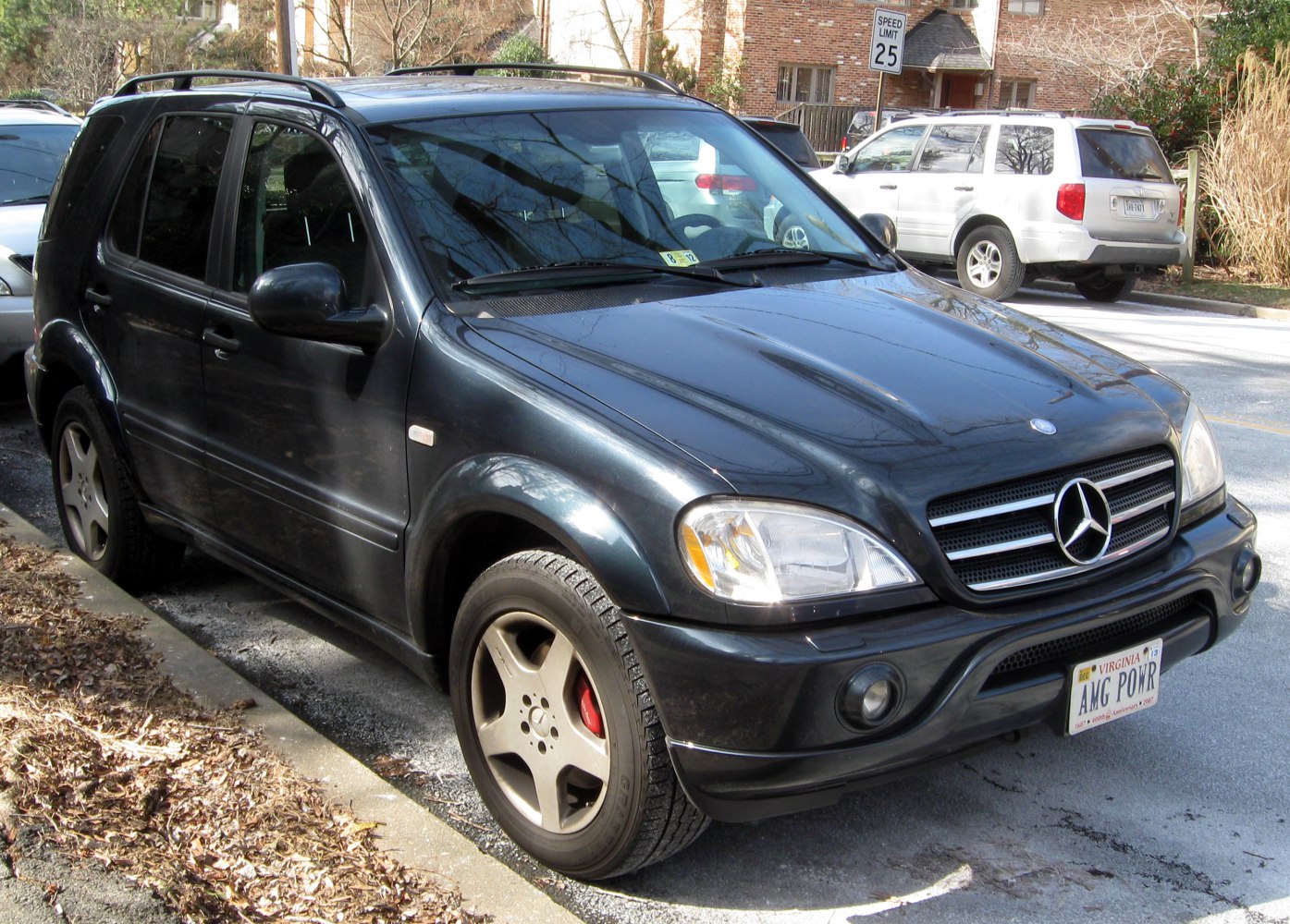 Front side view of SUV with AMG wheels