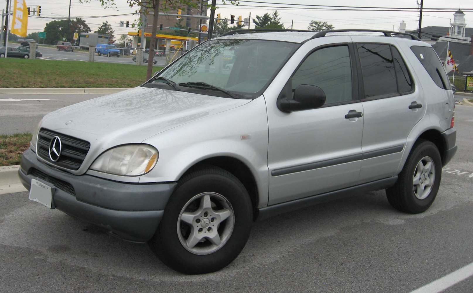 Silver SUV with star grille and five-spoke alloy wheels