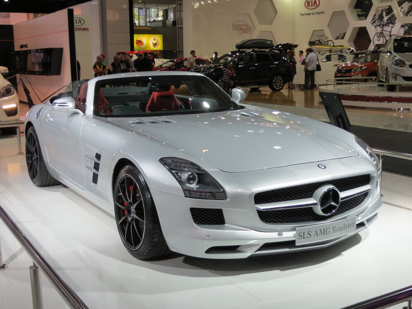 Silver luxury sports convertible with AMG grille and red interior seats
