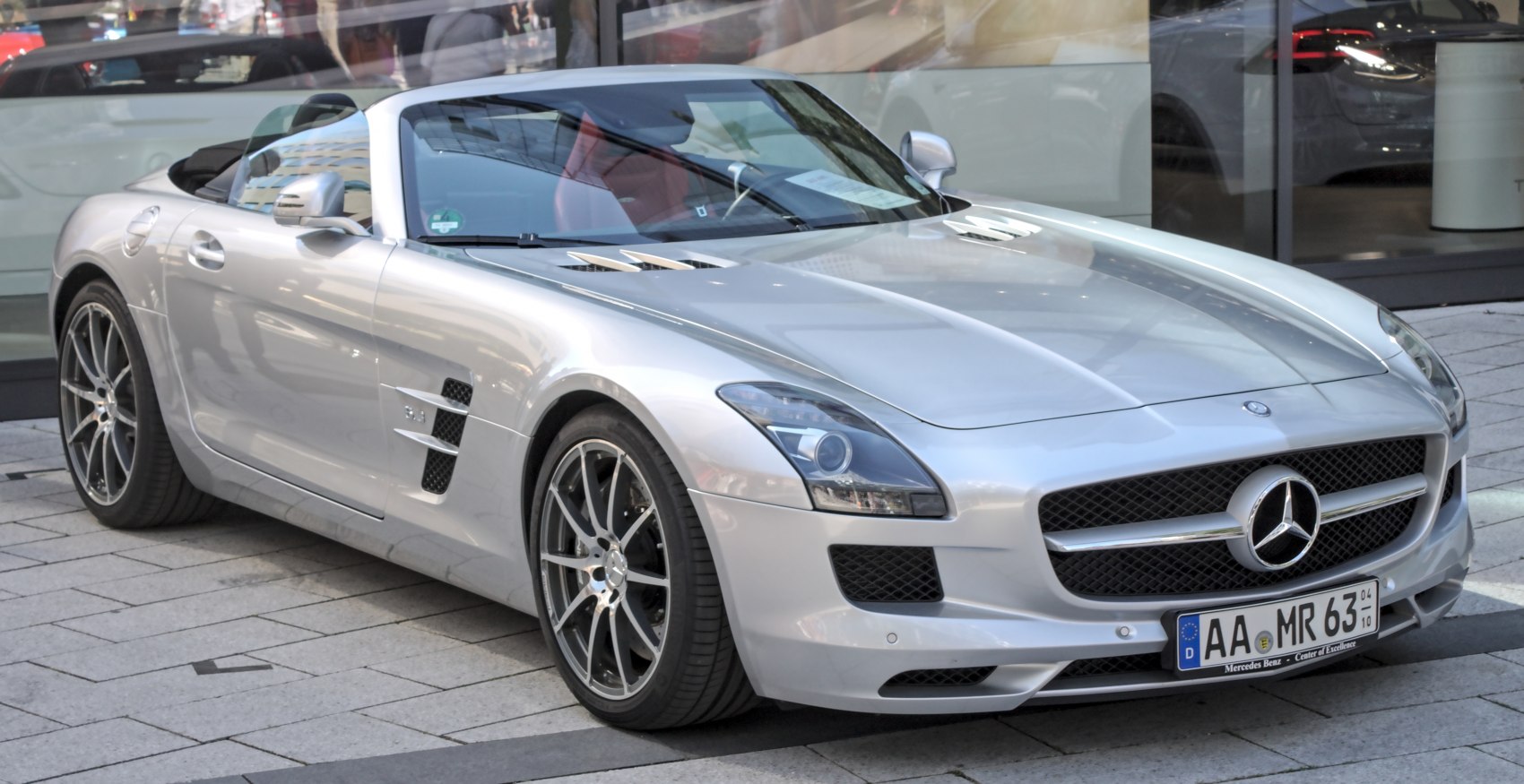 Convertible sports car with aerodynamic side vents and multi-spoke alloy wheels