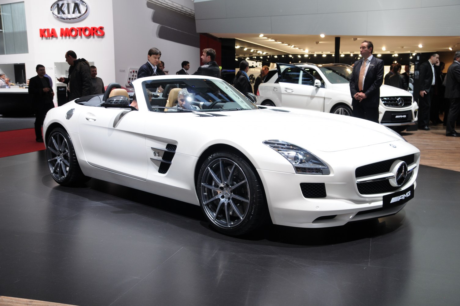 White convertible sports car with side vents and alloy wheels