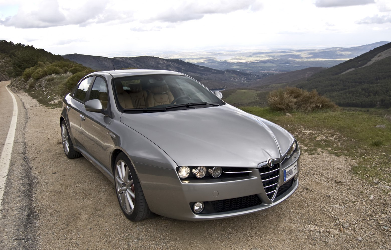 Front view with distinctive triangular grille and quad headlights