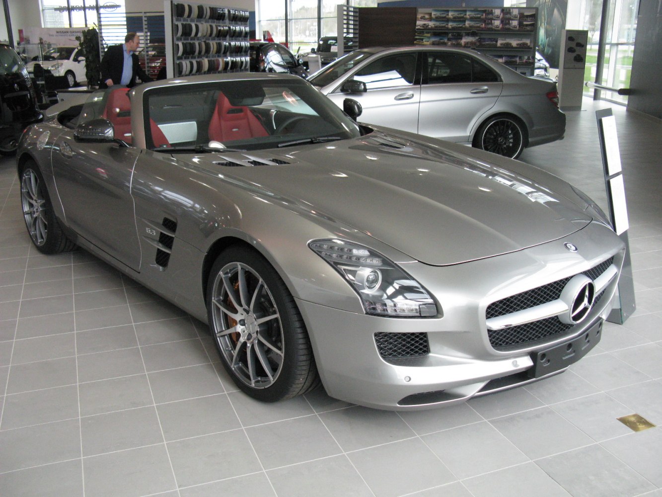 Open-top sports car with sleek front design and alloy wheels