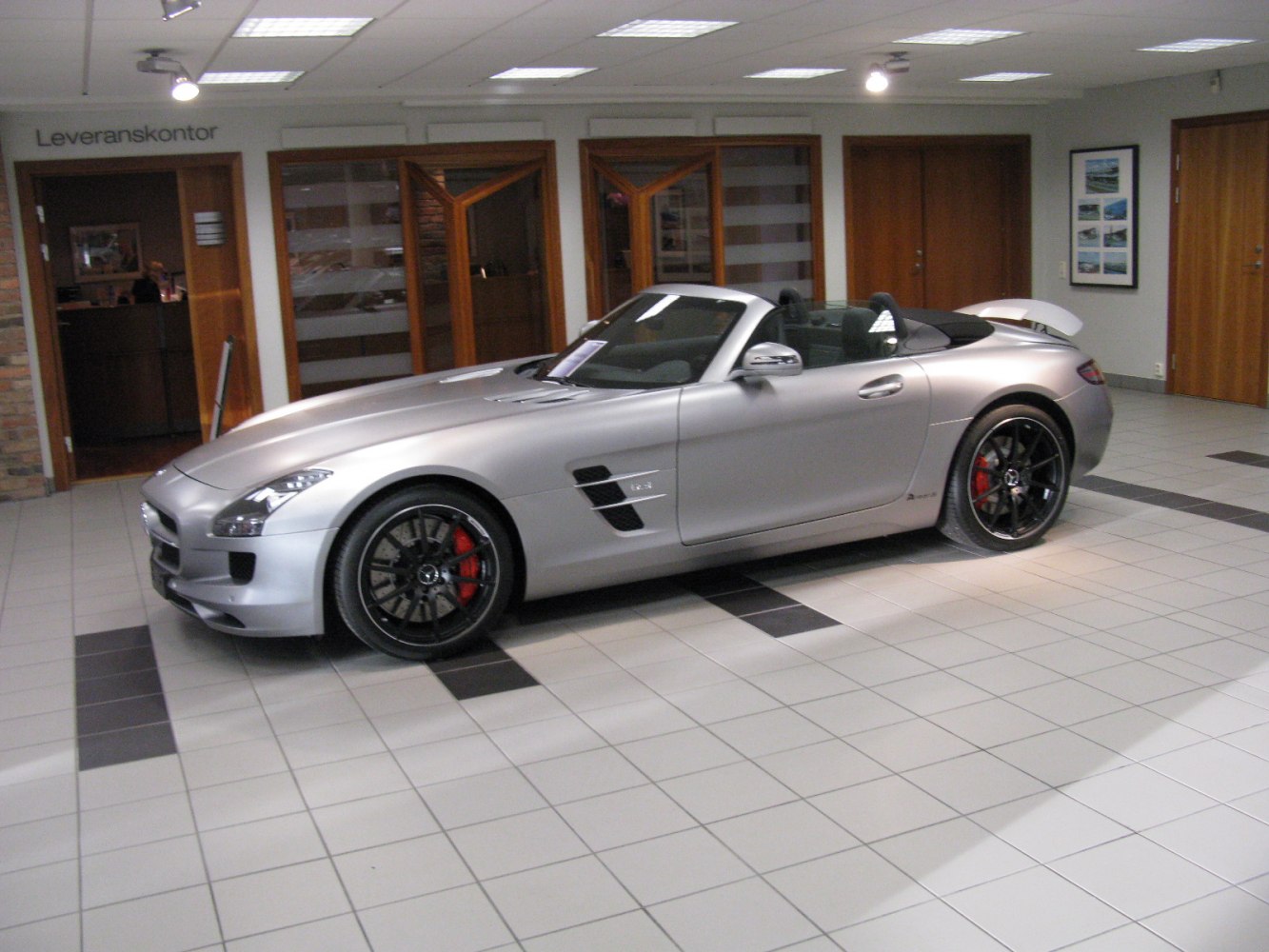 Silver convertible with black wheels and red brake calipers