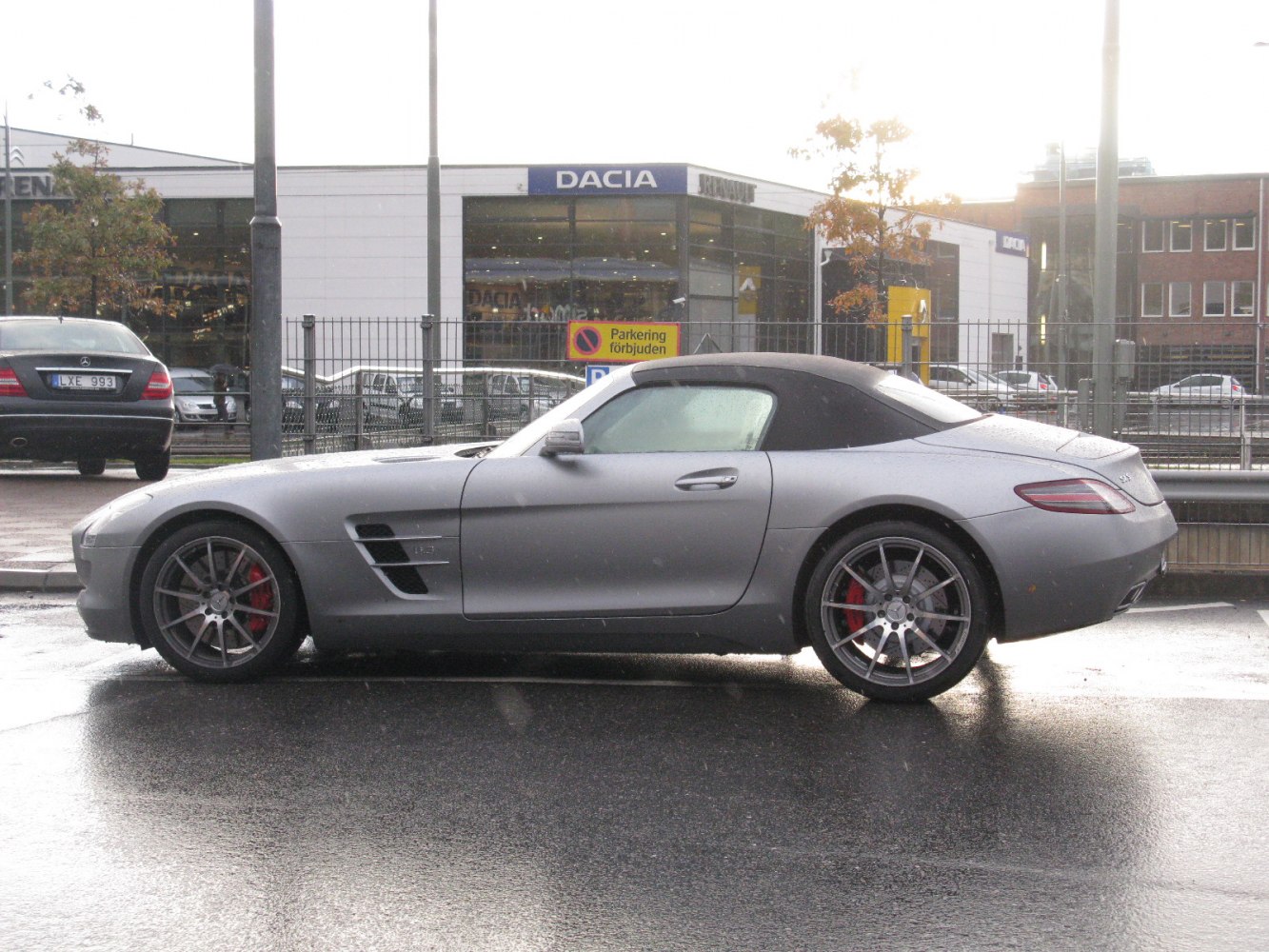 Convertible with soft fabric roof and sporty alloy wheels side profile