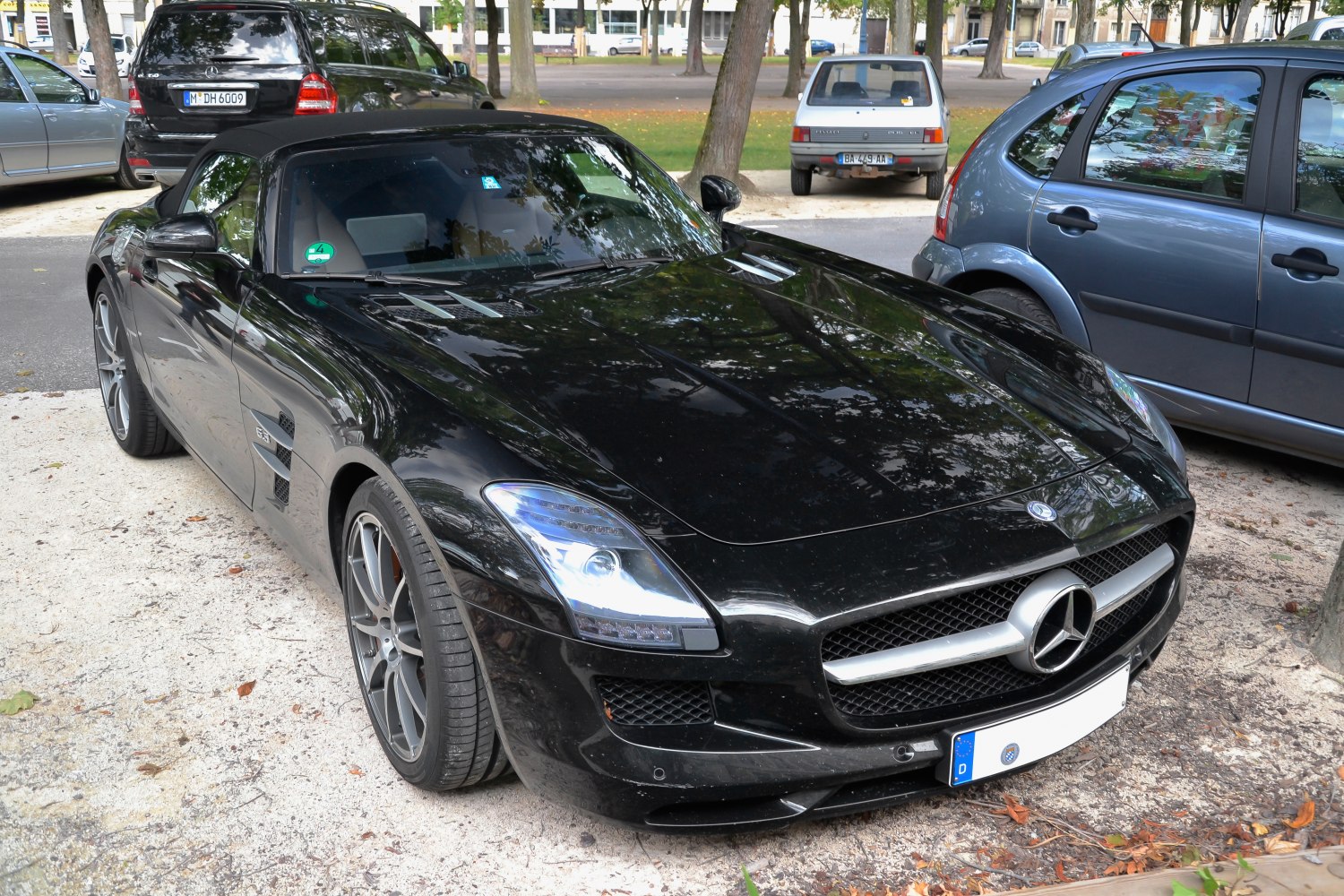 Black convertible Mercedes-Benz SLS AMG Roadster front with distinct grille