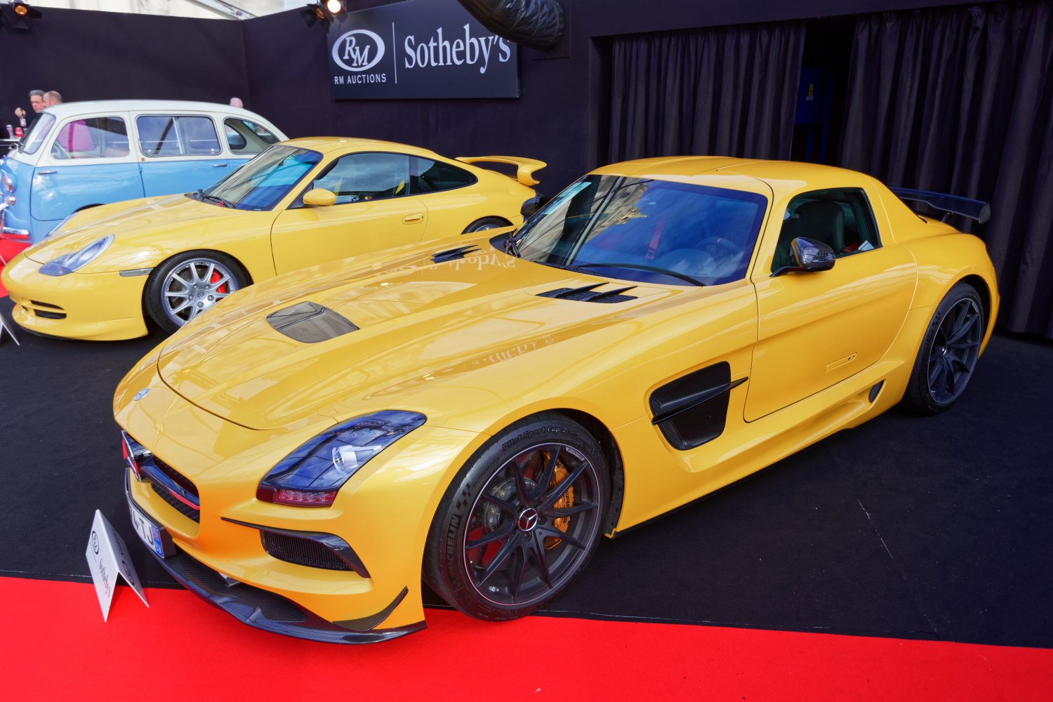 Yellow sports coupe with rear spoiler and aerodynamic vents