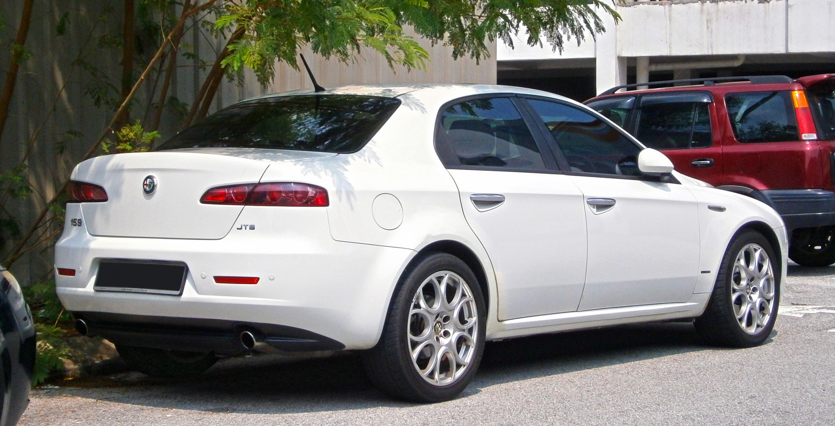 Rear view with sporty taillights and alloy wheels