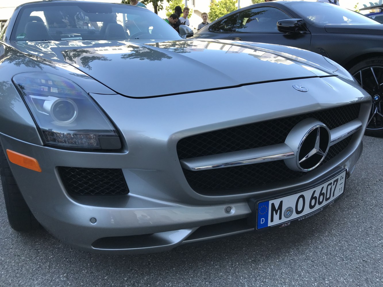 Close-up of front grille and headlights with sleek silver body