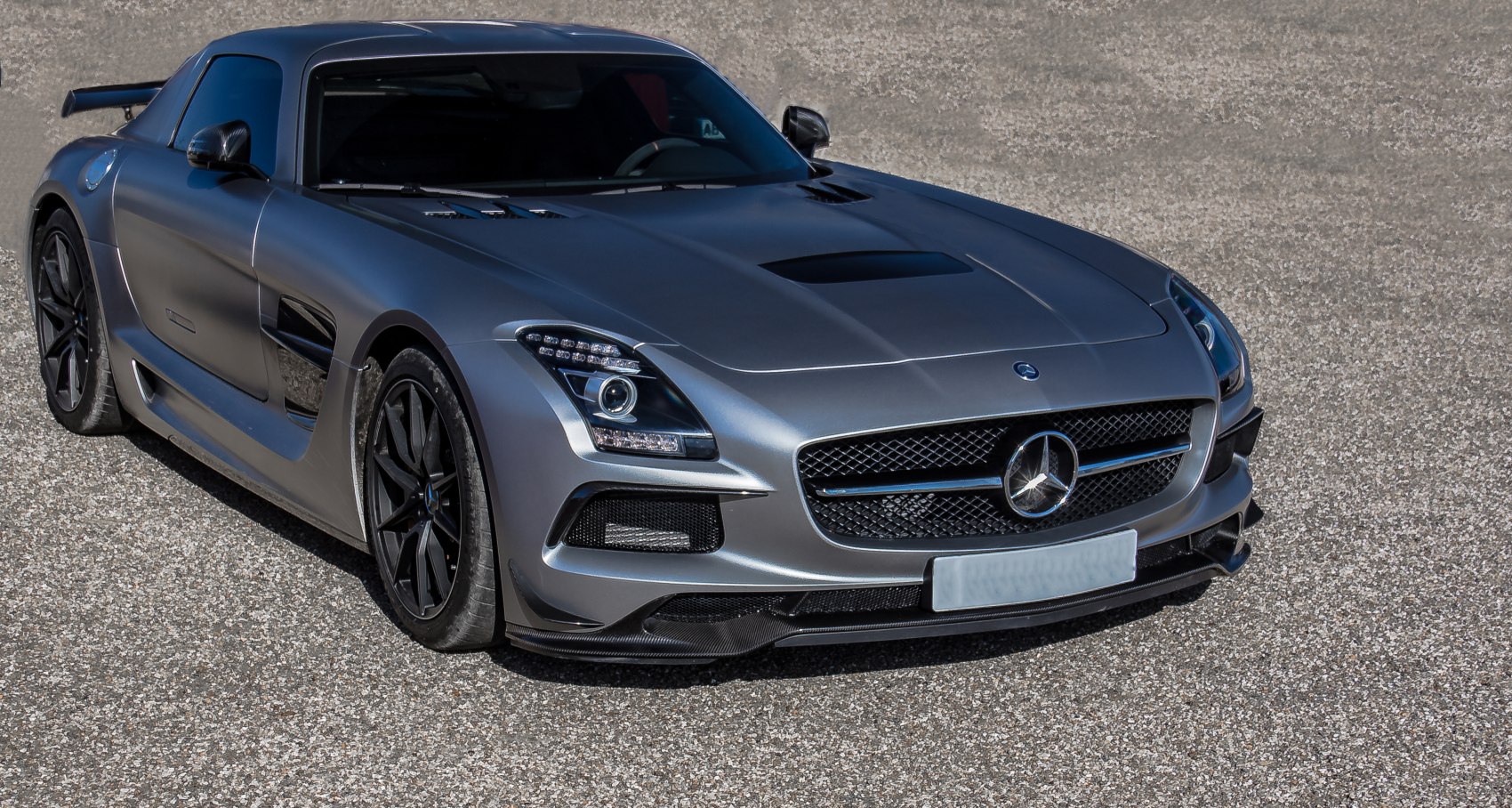 Luxury coupe front view with aerodynamic grille and sporty lighting