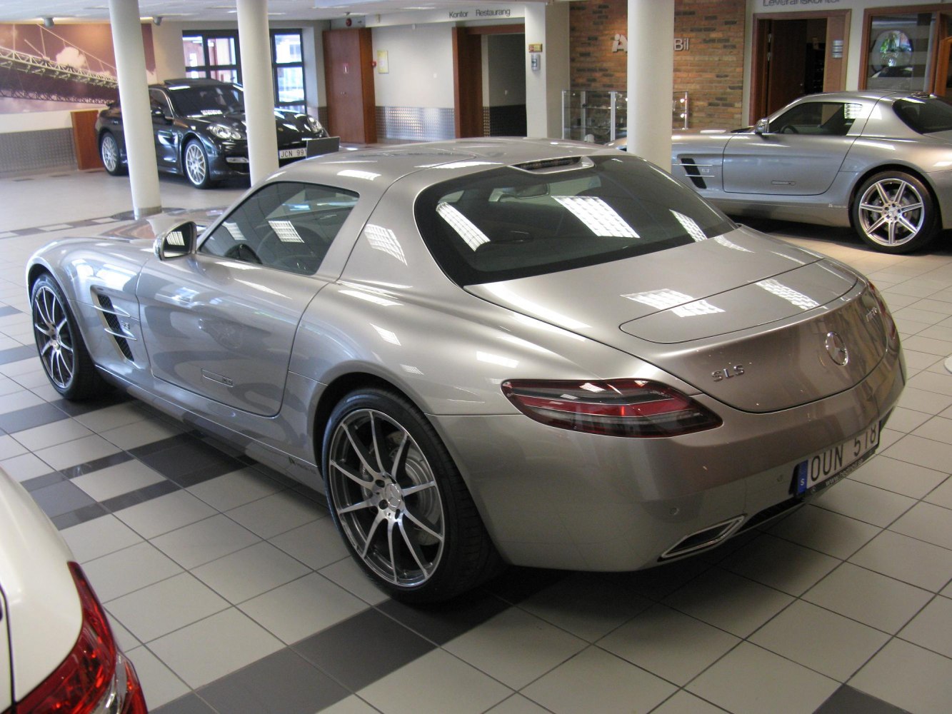 Rear and side profile with sleek curves and distinctive taillights