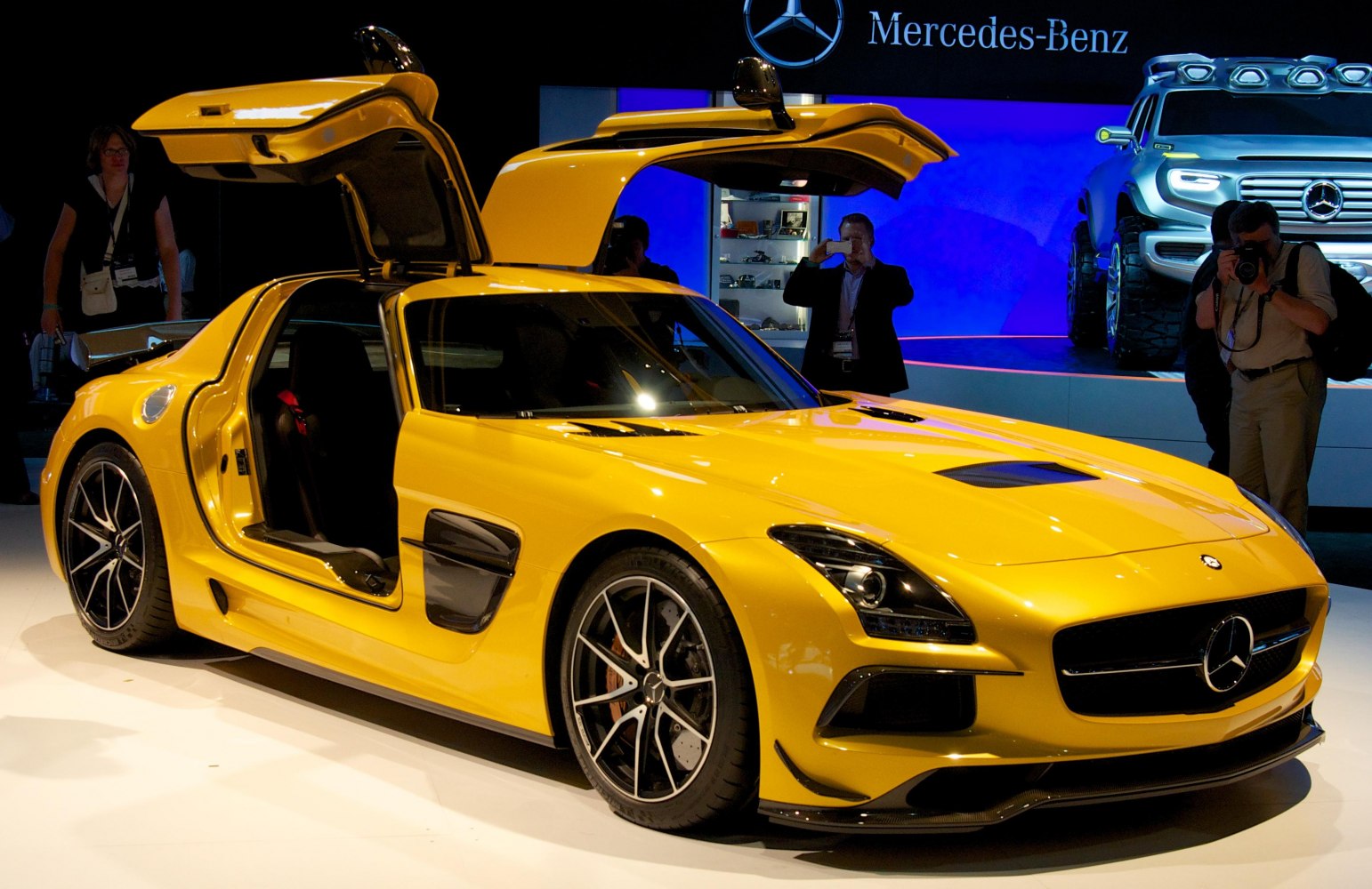 Yellow sports coupe with distinctive gullwing doors and aerodynamic design