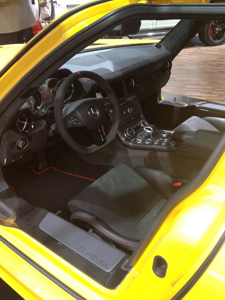 Sports car interior with carbon fiber trim and AMG steering wheel