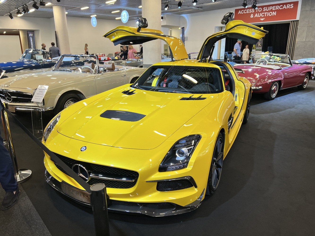 Yellow luxury coupe with gullwing doors front view