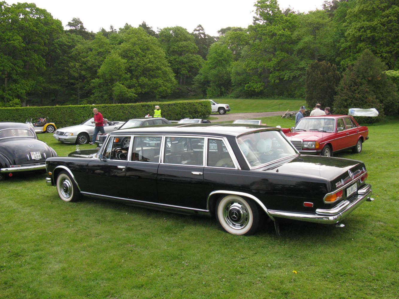 Extended wheelbase luxury limousine with chrome trim and classic styling