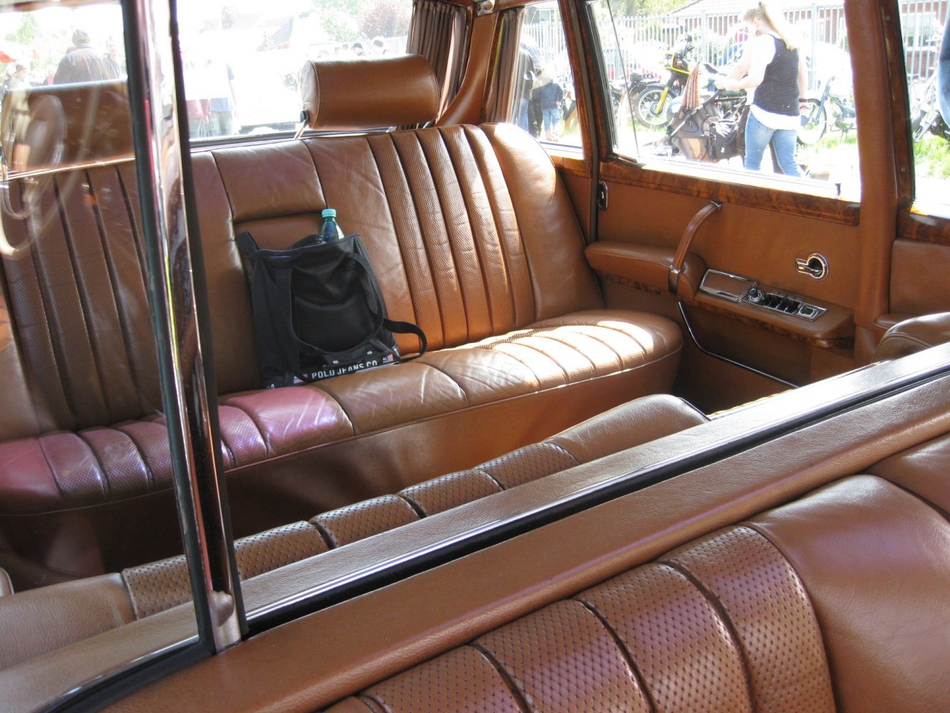 Vintage brown leather interior with plush seating and window dividers