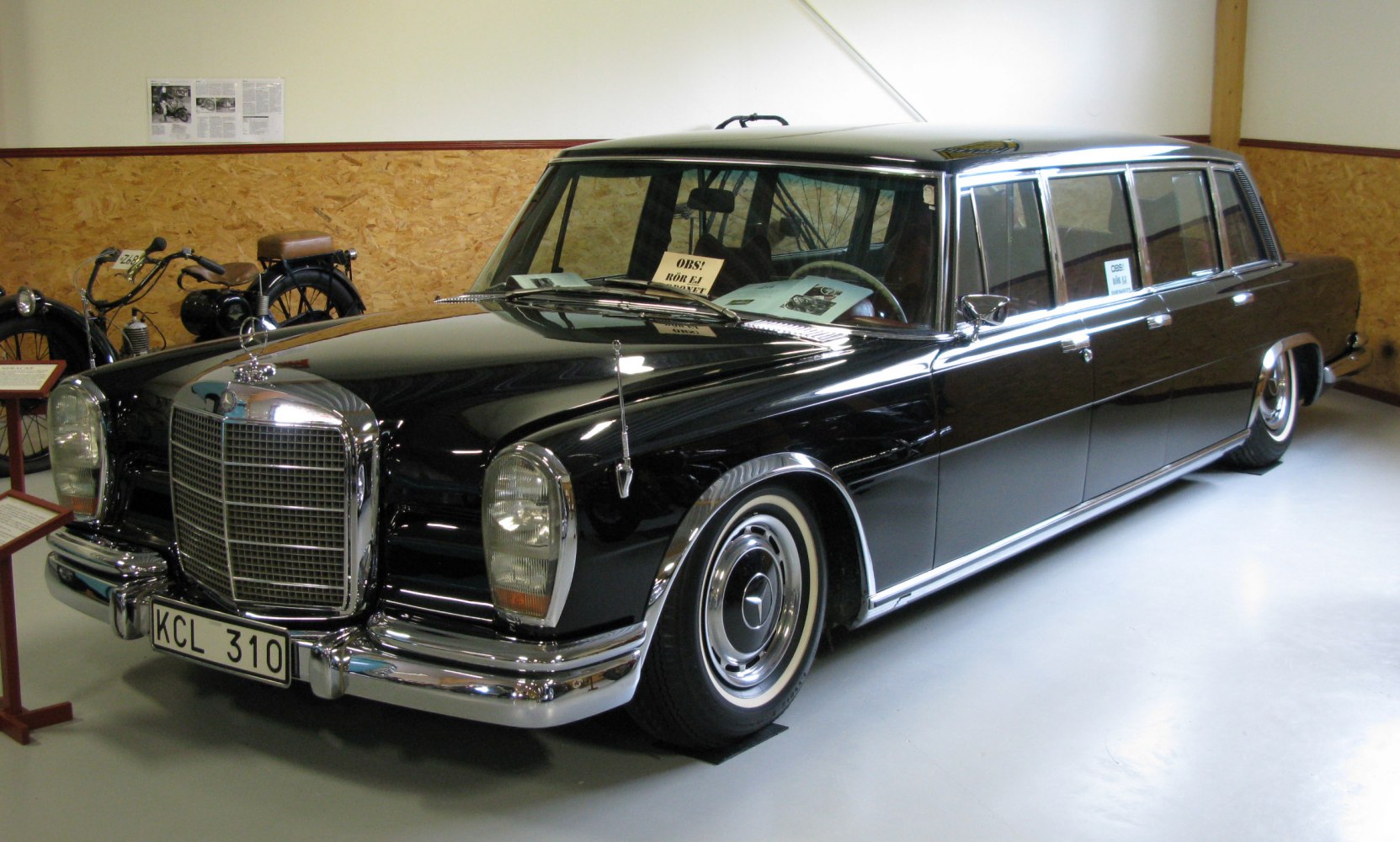 Elongated vintage limousine with classic styling and chrome accents