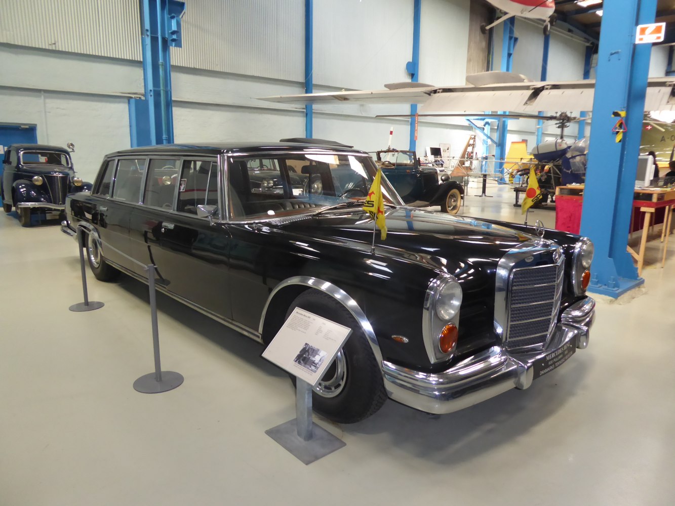 Vintage luxury limousine with long body and distinctive front design