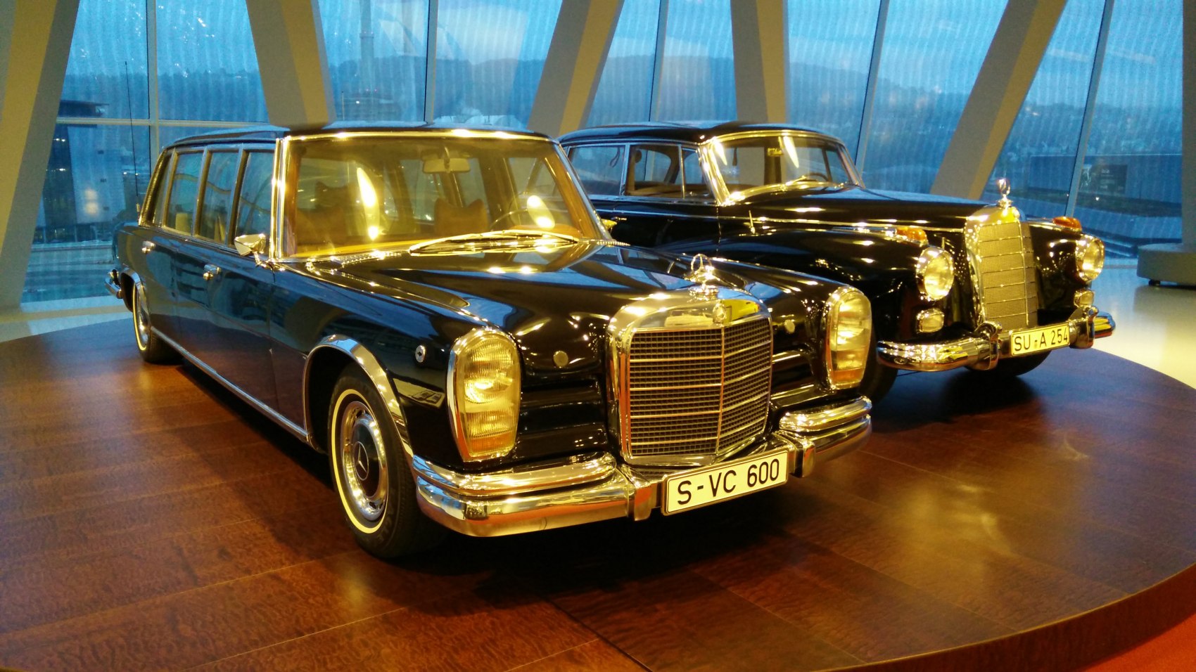 Long luxury sedan with large chrome grille and extended body