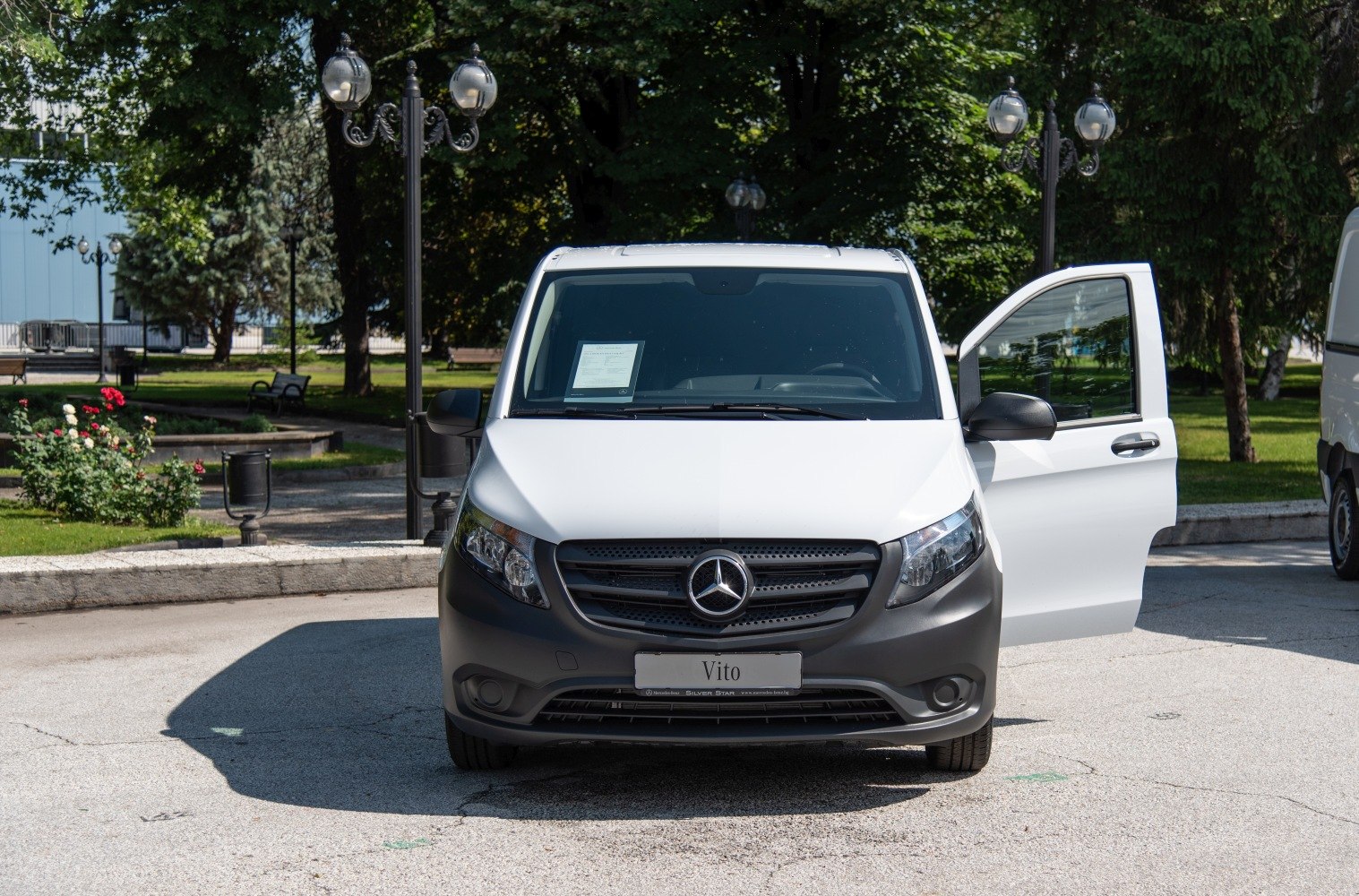 Front view of van with open driver's door