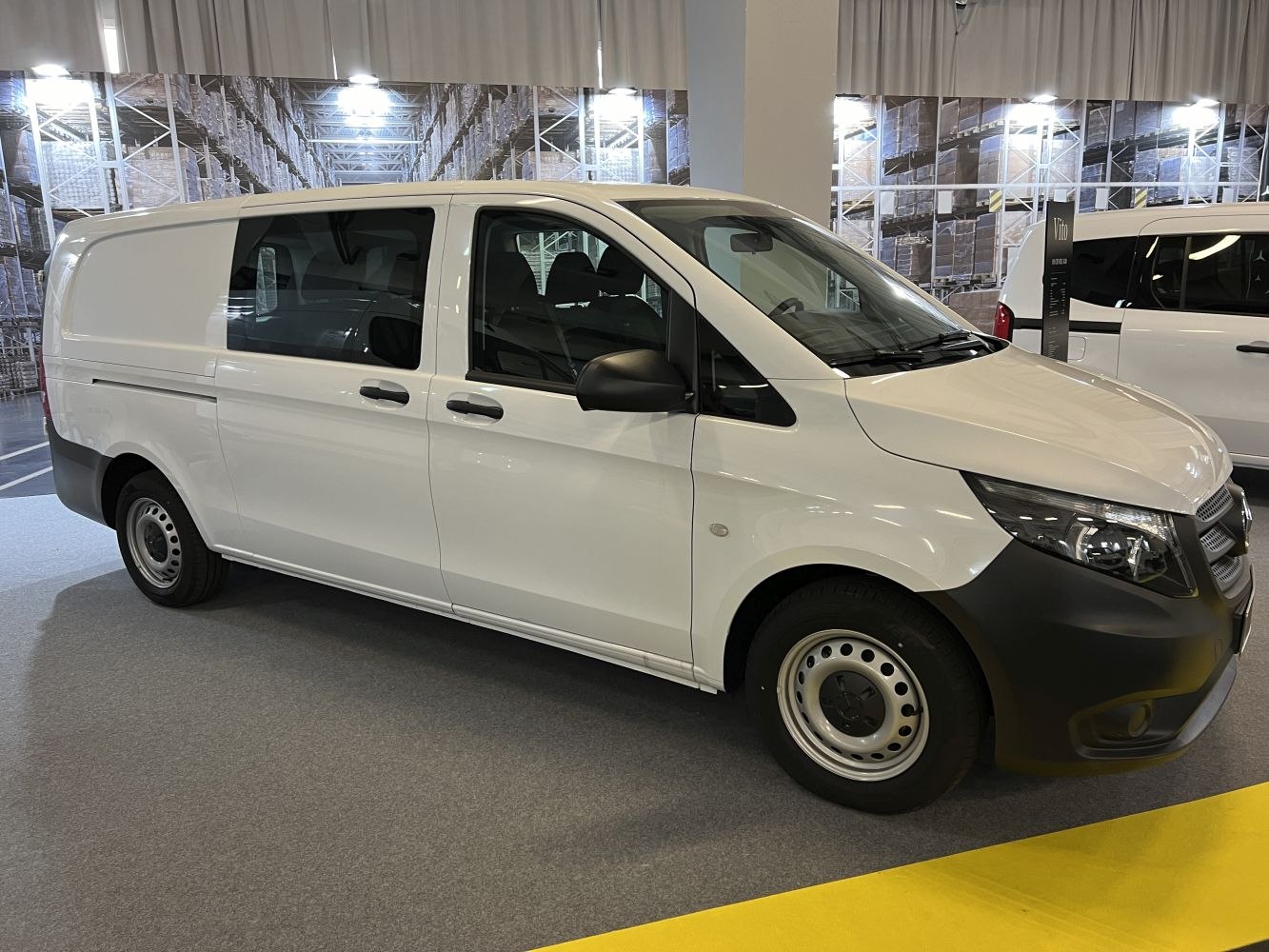 Extra long van with sliding side door and black steel wheels