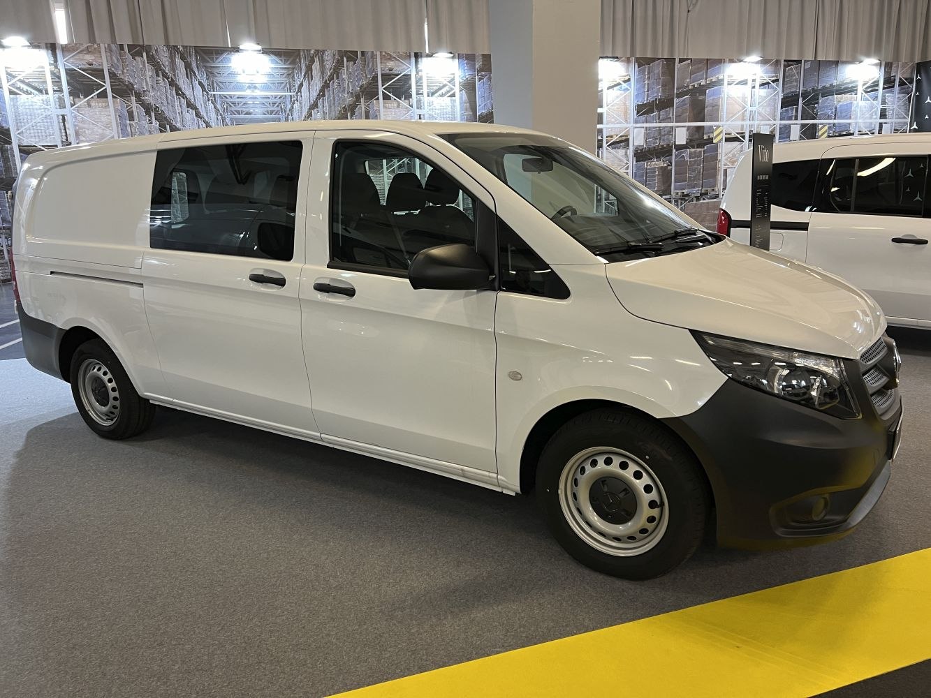 Side view of extra long delivery van with multiple doors