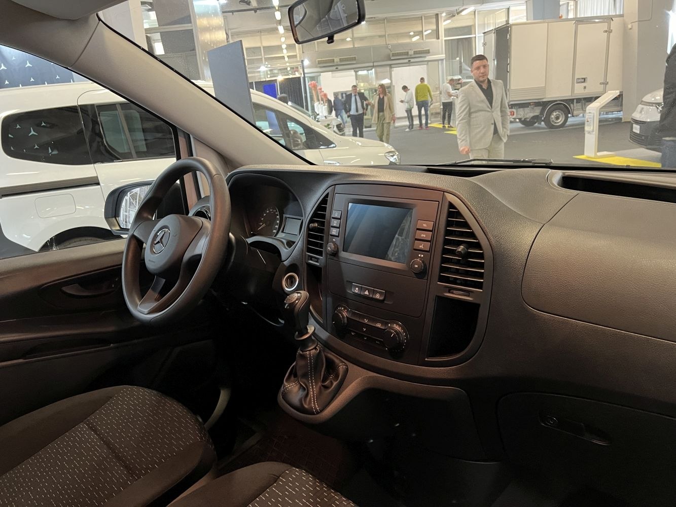Interior dashboard and steering wheel with infotainment control panel