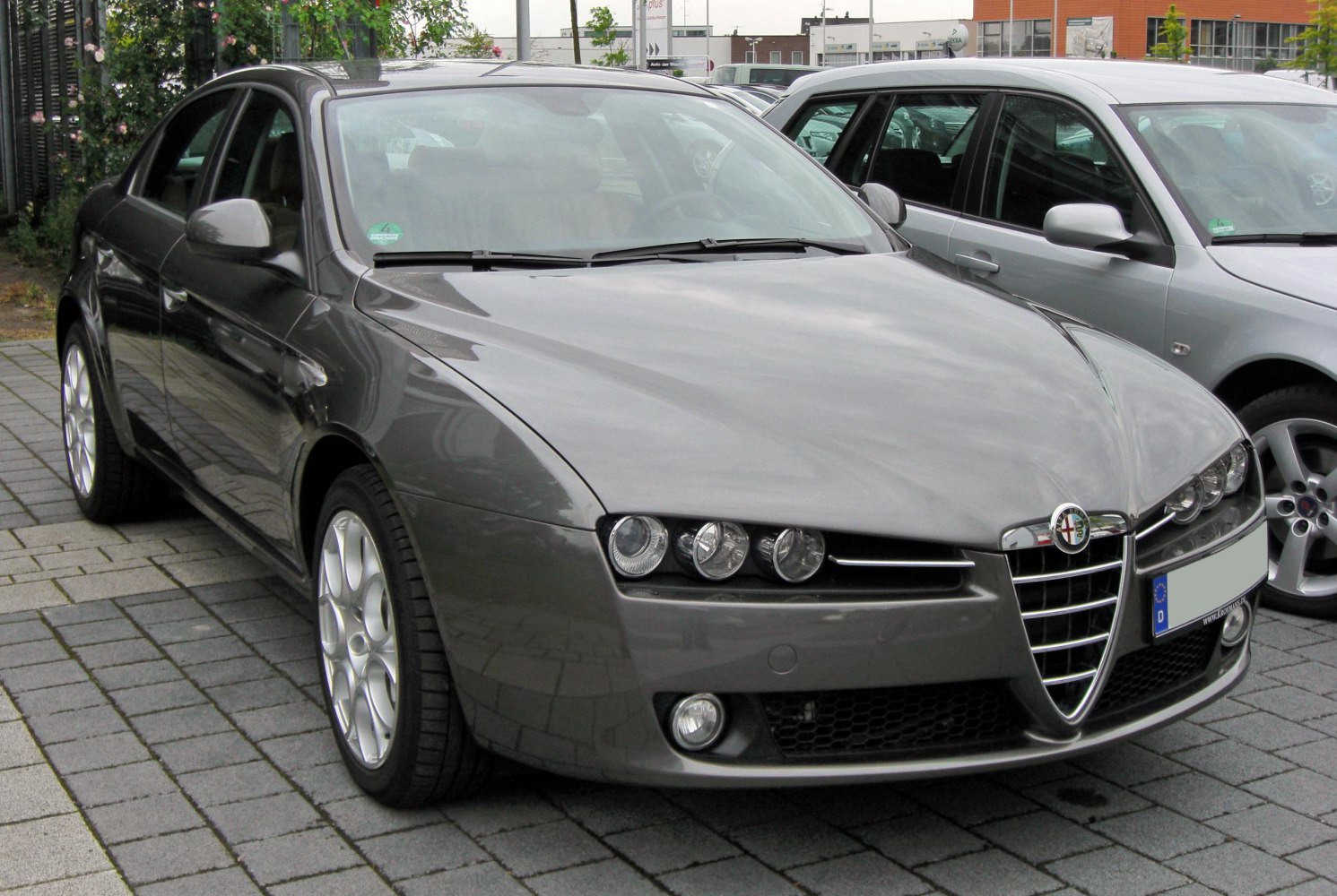 Front view with triple round headlights and iconic shield grille